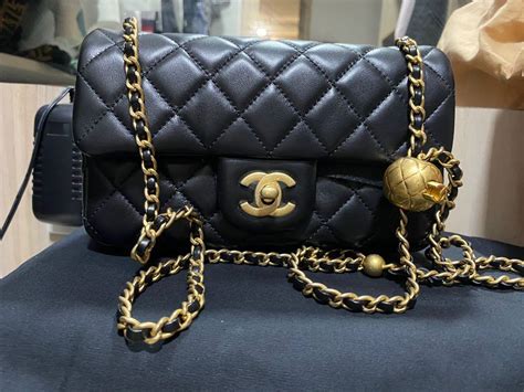 chanel bag with ball on chain